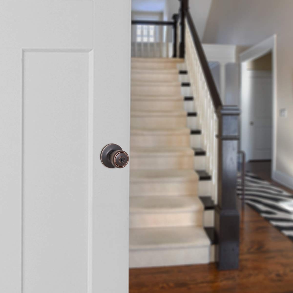 AmazonBasics Exterior Door Knob With Lock, Bell, Oil Rubbed Bronze