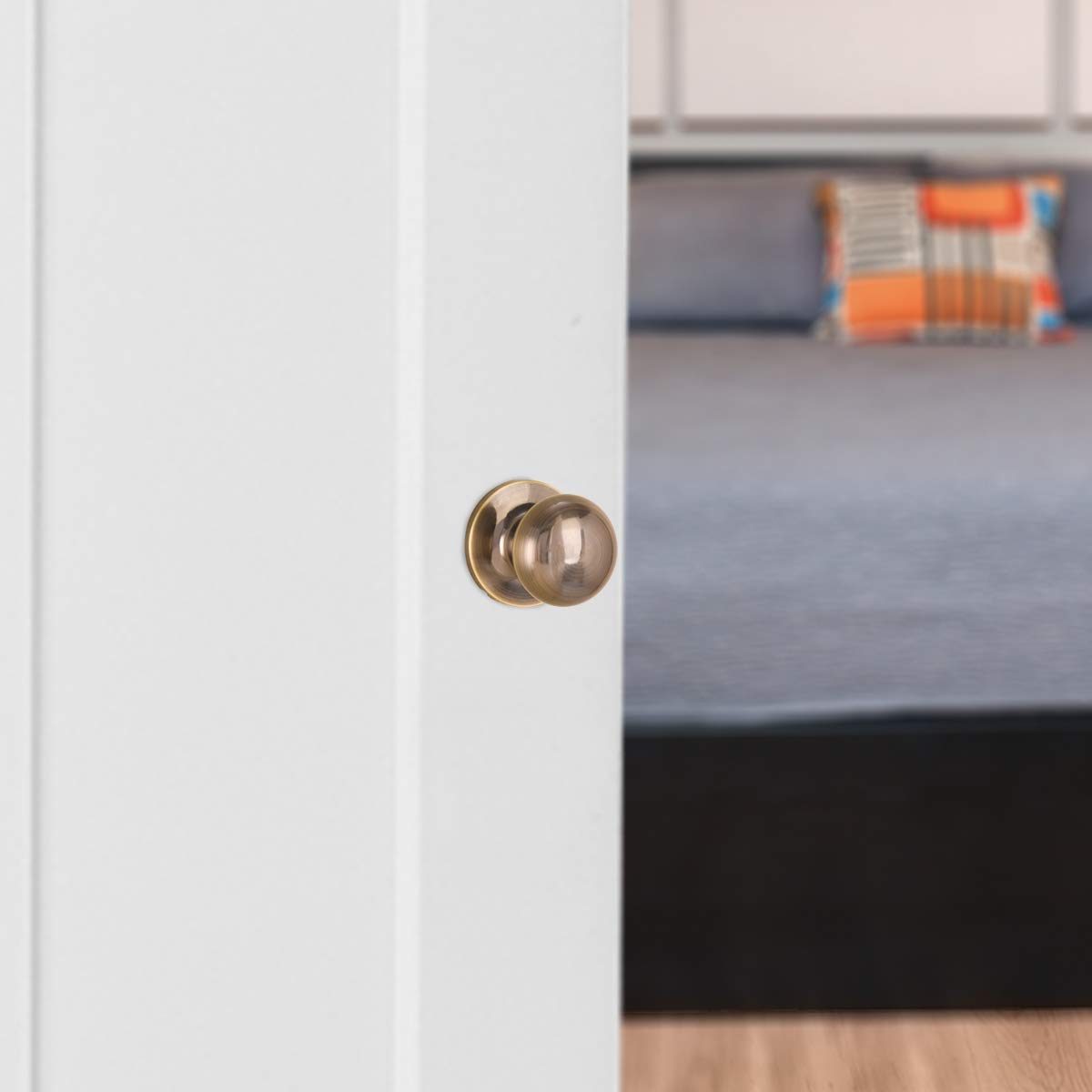 AmazonBasics Closet Door Knob, Round, Antique Brass